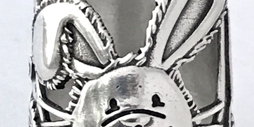 Close-up of a sterling silver thimble featuring a detailed rabbit design, part of The Latest Thimbles for 2021.