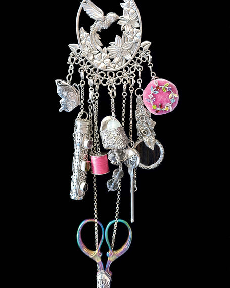 Hummingbird Collection featuring sterling silver charms, scissors, and sewing accessories in an artisan design.