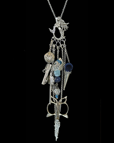 Mermaid Collection silver thimble jewelry with charms including a mermaid pendant and blue glass accents.