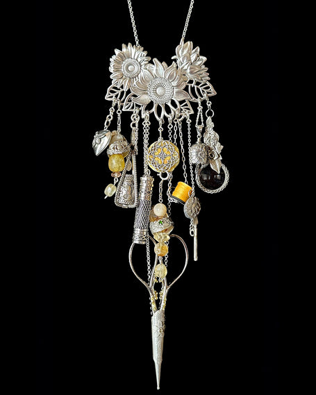 Sunflower Collection featuring handmade sterling silver chatelaine with thimble accessories and floral design.