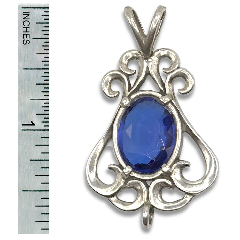 Close-up of the Flourish Chatelaine featuring a blue gemstone set in sterling silver, measuring 1 inch.