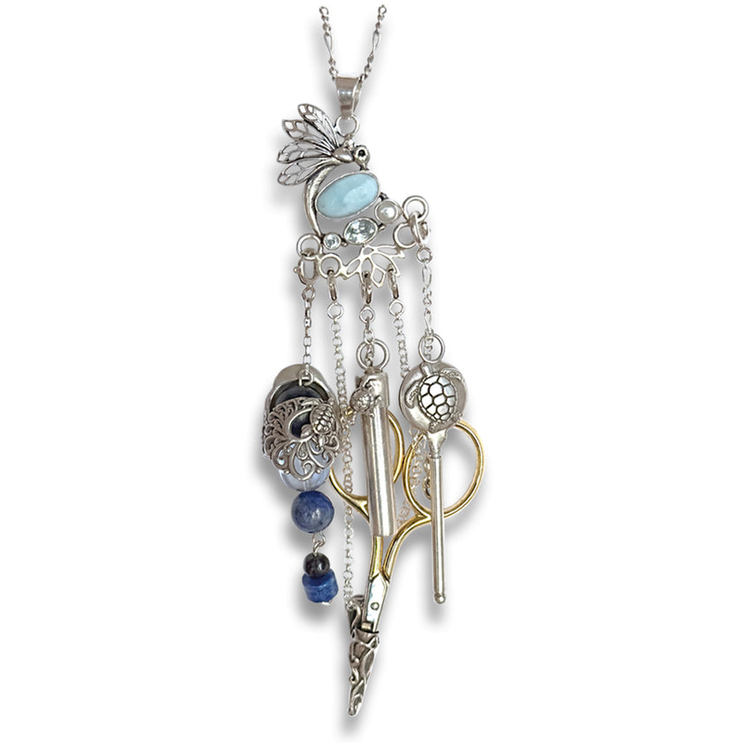 Dragonfly with Larimar Chatelaine featuring intricate sterling silver thimbles and sewing tools for crafting elegance.
