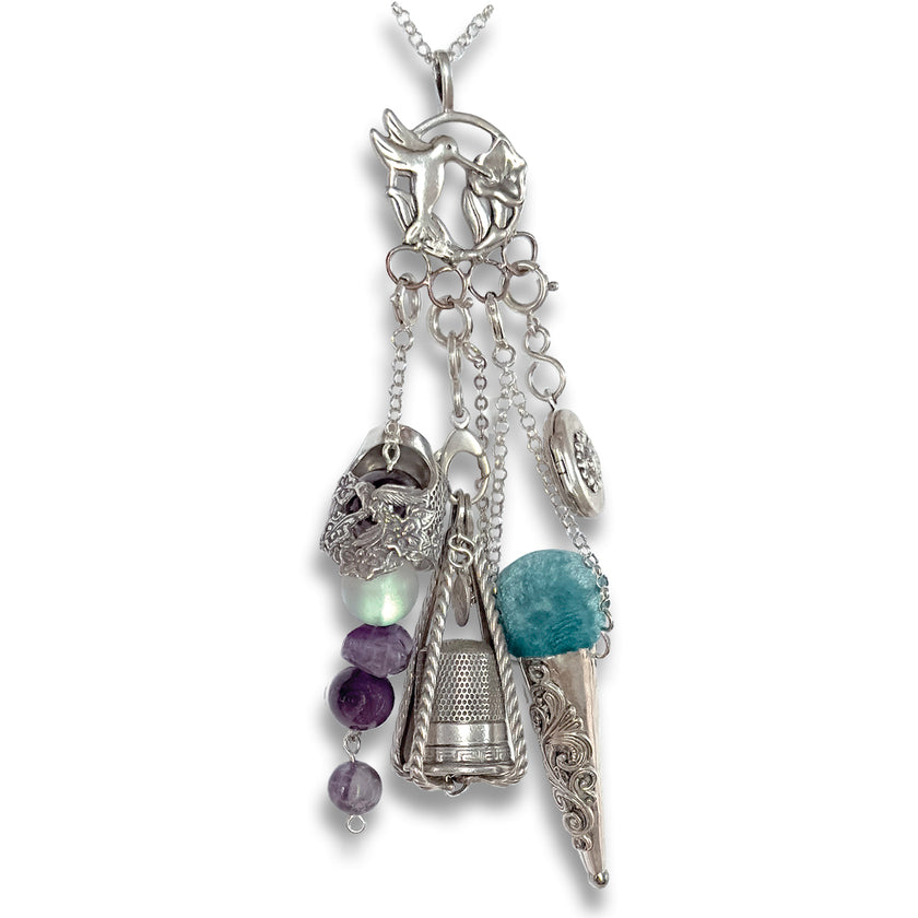 Hummingbird Chatelaine featuring sterling silver thimbles and unique charms, elegant accessory for sewing tools.