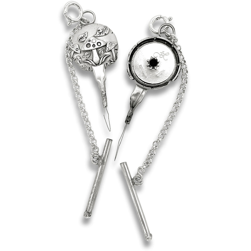 Mushroom Combination Tool - Needle Threader and Thread Cutter featuring intricate silver design and chain connection.