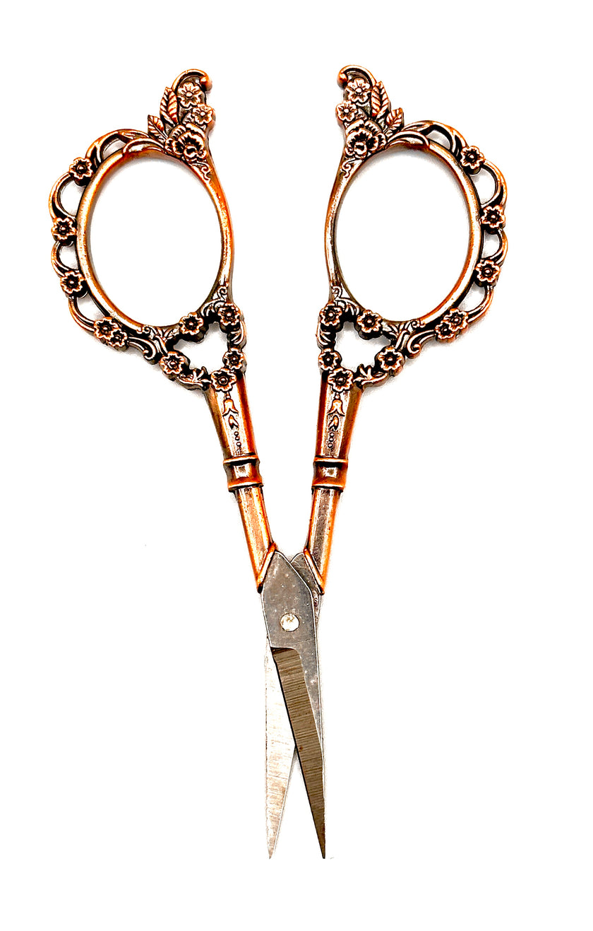 Copper Handle Scissors with intricately designed copper handles, ideal for crafting and sewing projects.