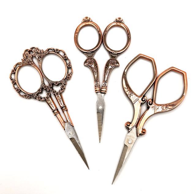 Copper Handle Scissors in various designs, perfect for sewing and crafting projects.