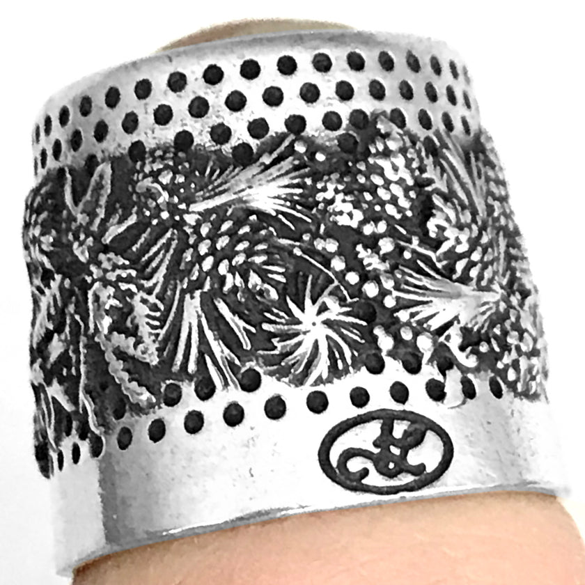 Winter Evergreen Tailor's Thimble made of sterling silver with a winter wreath design.