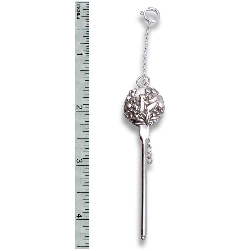 Lily of the Valley Combination Tool - Needle Threader and Thread Cutter next to a ruler for size comparison.