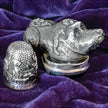 Thimble Box - Dog Small in sterling silver with intricate dog design and unique thimble features on a purple background.