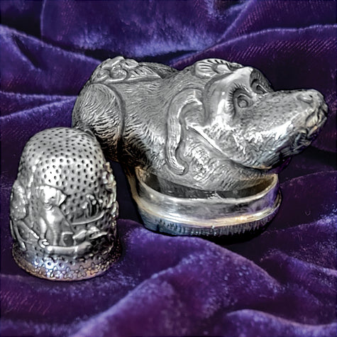 Thimble Box - Dog crafted in sterling silver, featuring a detailed dog design and a closed-top thimble accessory.
