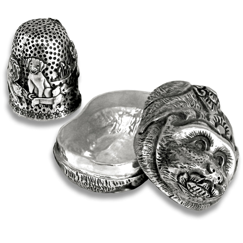 Thimble Box - Dog Small made of sterling silver, featuring intricate designs of dogs and a closed-top structure.