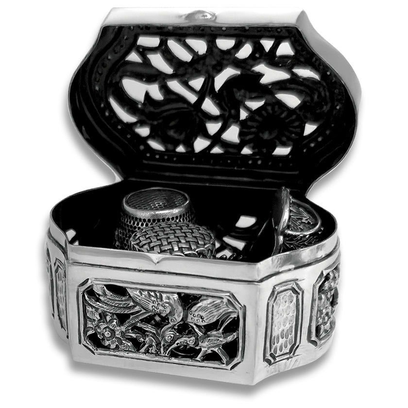 Thimble Box - Cutout showcasing ornate sterling silver design and interior thimble collection by artisans in Bali.
