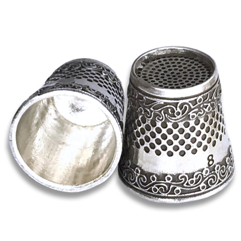 Art Thimble made of sterling silver, featuring intricate designs and an open nail for easy sewing and quilting.