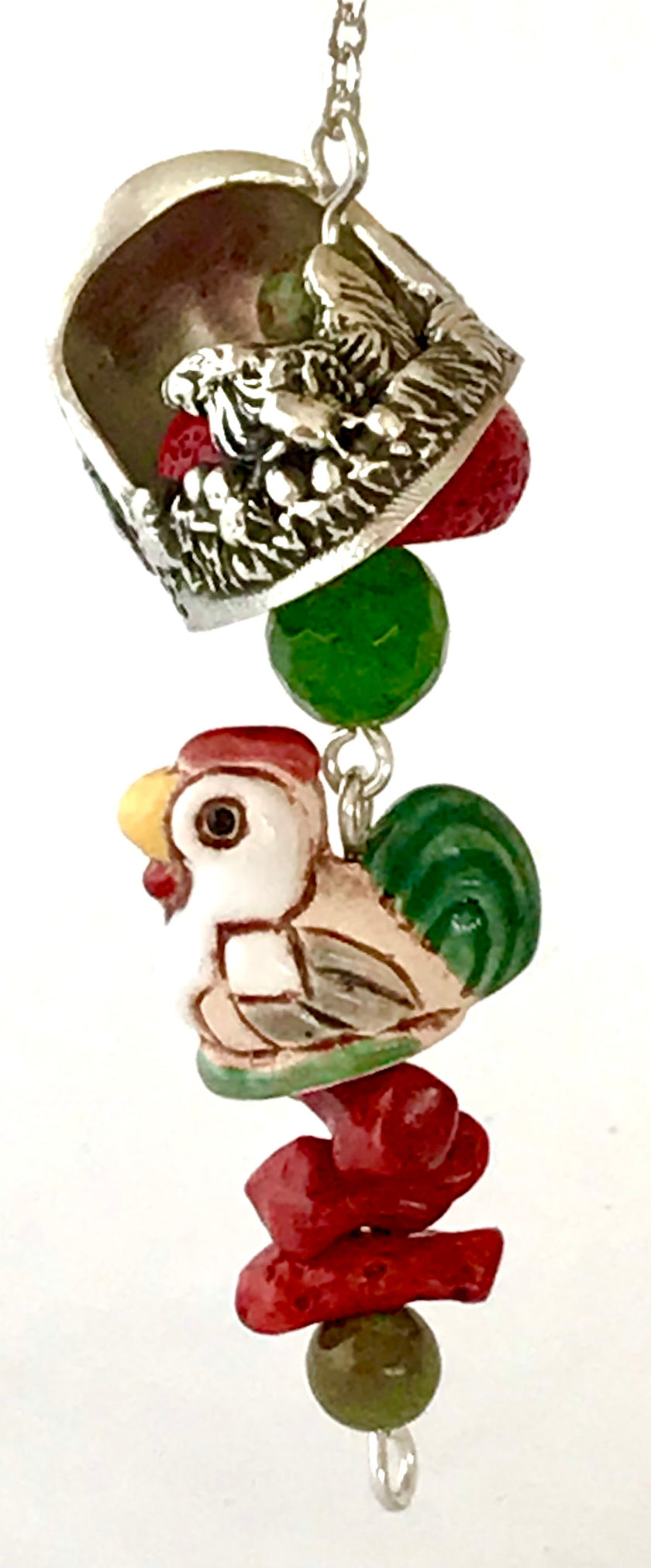 Bobble with Gems Only featuring colorful beads and a decorative chicken charm on a silver thimble.