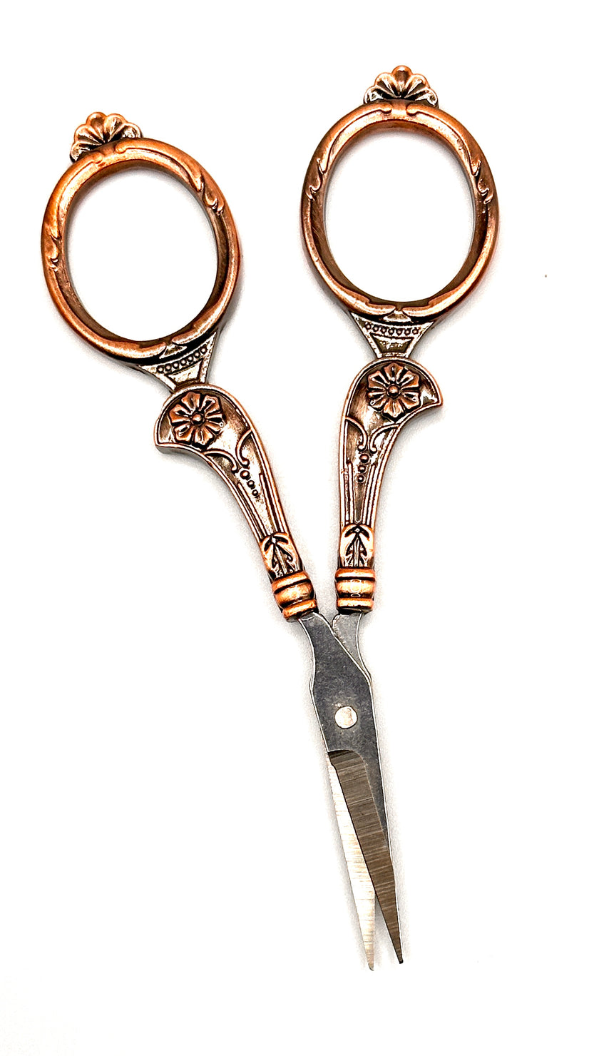 Copper Handle Scissors with ornate design, perfect for crafting and sewing projects.