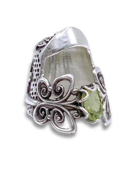 Handmade sterling silver thimble with floral design and green gemstone, ideal for sewing and crafting.