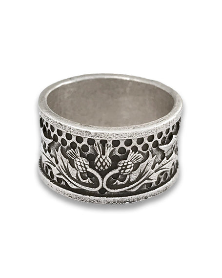 Sterling silver thimble with intricate floral design, ideal for quilting and sewing enthusiasts.