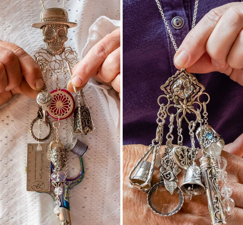 Close-up of unique silver chatelaines adorned with thimbles and sewing accessories, showcasing heirloom quality craftsmanship.