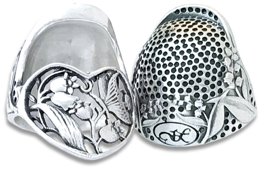 Lily of the Valley Thimble featuring intricate silver floral design, ideal for sewing and thimble collections.