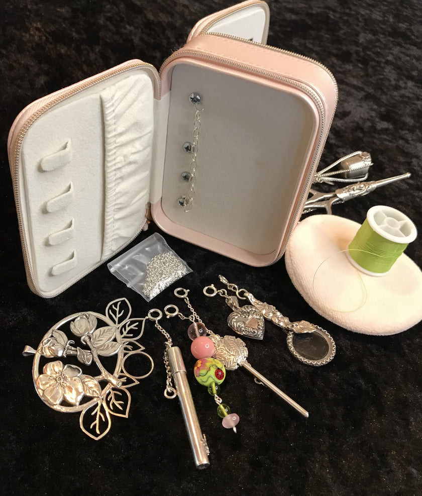 Sewing Travel Kit with thimble accessories, sterling silver thimbles, and handmade sewing tools.