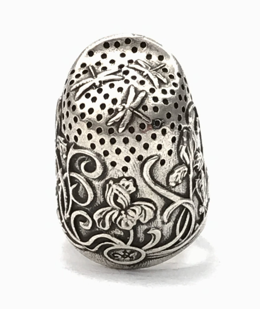 Dragonfly and Iris Thimble, a handmade sterling silver thimble featuring intricate dragonfly and iris designs.